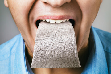 A person has toilet paper instead of a tongue. Concept on the topic of sycophancing.