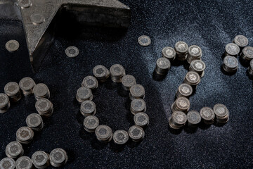 High angle view of New Years 2021 as Swiss coins on a black background.
