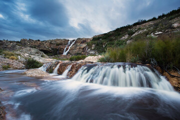 Fototapeta na wymiar Wide angle view of Tulbagh Waterfall in flow after good winter rains in the Western Cape of South Africa.