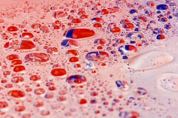Water drops texture background. Water drops. Red and blue.Selective focus.
