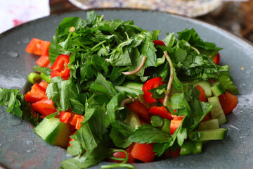 Plate full of healthy salad.