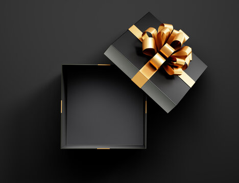 Black opened empty gift box with golden ribbon isolated on black background - 3D illustration