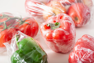 single use plastic packaging issue. peppers tomatoes apples vegetables in plastic bags