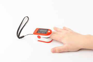 Pulse Oximeter, finger digital device to measure oxygen saturation in blood. Coronavirus symptoms concept.