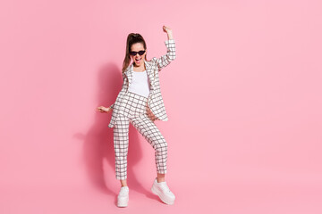 Full body photo of young woman happy smile have fun enjoy party dance wear pants isolated over pink color background