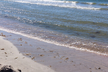 The background of sand with water splash into summer with space for text.