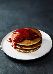 European breakfast of pancakes with strawberry jam