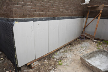 Foundation and basement thermal polystyrene insulation: Rigid eps foam  boards are installed before...