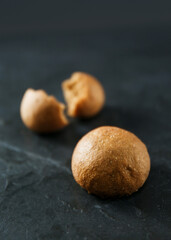 Obraz premium Soft small bun made from rye flour on gray background