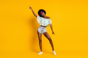 Fototapeta na wymiar Full length body size photo of black skinned woman relaxing on dancefloor summer party isolated on bright yellow color background