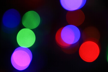 colorful Christmas lights bokeh on a black background