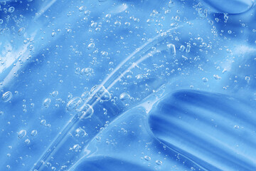 Blue gel smear swatch. Antibacterial sanitizer for hygiene sample. Jelly texture with collagen and...