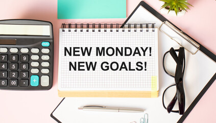 New Monday New Goals Concept on office desktop top view with office supplies.