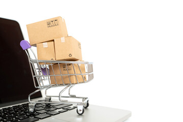 Paper boxes in a trolley on white background .Online shopping or ecommmerce concept and delivery service concept with copy space for your design.