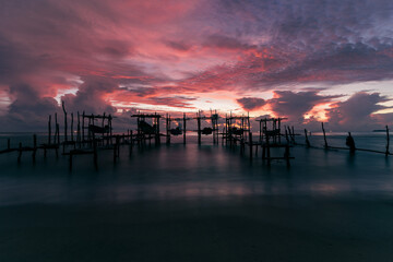 Morning view before sunrise Fishing boat's harbor service at Bang Hoi Beach, Songlkhla, Thailand.