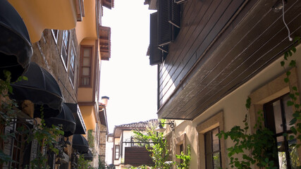 Detailed view of houses and narrow street at old city of Antalya, Turkey. Narrow turkish street with buildings, detailed view.