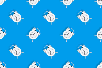 Seamless patterns. Alarm clocks seamless pattern. Alarm clocks background.