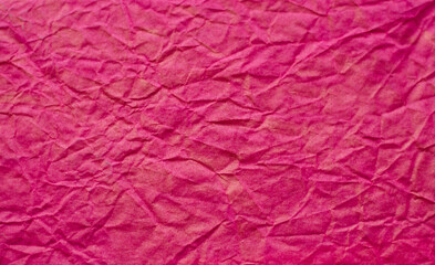 Crumpled red pink old paper abstract wall background.