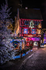 Colmar center at Christmas illuminated and decorated at night - obrazy, fototapety, plakaty
