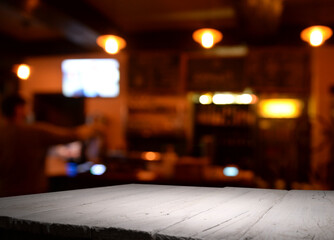 Classic bar counter with bottles in blurred background