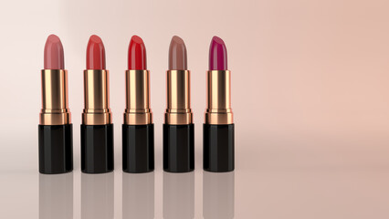Obraz premium Set of colourful lipsticks in glossy gold and black containers. This is against a nice sunset shaded 