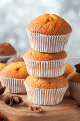 Delicious fresh muffins with star anise on a wooden stand, cool after baking. Sweet dessert.