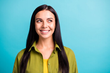 Fototapeta premium Close up portrait of pretty cheerful brown hair lady look empty space dress green shirt isolated on teal color background