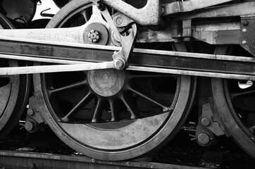 Wheels of a steam locomotive in a museum in Budapest, Hungary. Detail on the wheels, wheelset and chassis of a historic steam locomotive.