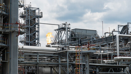 Refinery process area of petrochemical plant on dramatic sky background. Industrial concept.