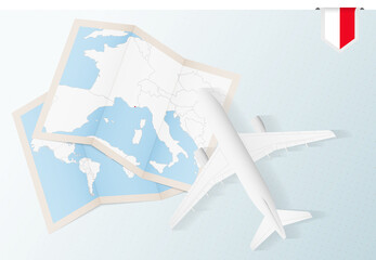 Fototapeta na wymiar Travel to Monaco, top view airplane with map and flag of Monaco.