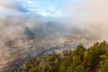 Aerial View of Squamish City during a sunny sunset. Taken from Chief Mountain, near Vancouver, British Columbia, Canada.