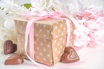 Valentine gift with flowers and chocolates. Valentine day tender and sweet romantic background