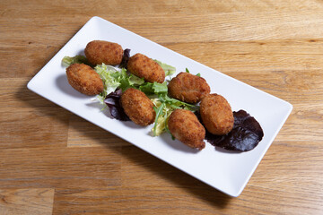 Croquettes croquetas in a white plate.