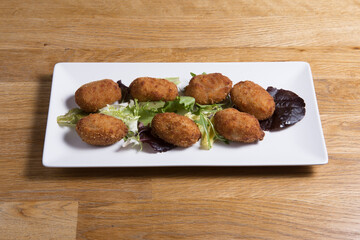 Croquettes croquetas in a white plate.