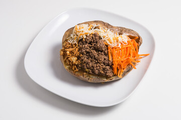 Delicious stuffed sweet potato with minced meat, carrot and cheese