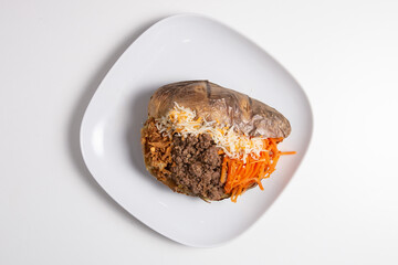 Delicious stuffed sweet potato with minced meat, carrot and cheese