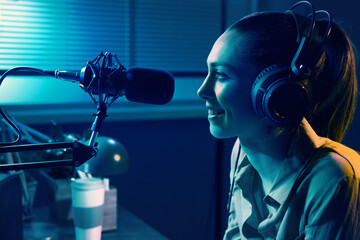 Young woman working at the radio station