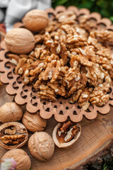 Walnuts lying on a cutting wooden board.