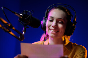 Young radio presenter broadcasting news