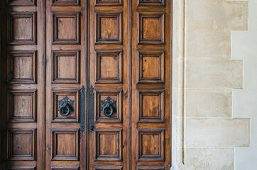 Old wooden door with metal handles in Palma de Mallorca, Spain