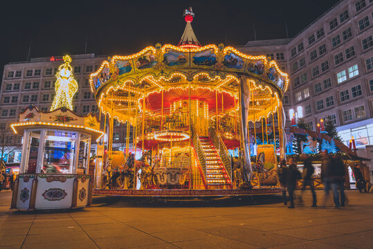 A christmas carousel for children on alexanderplatz in berlin, germany