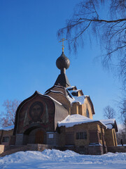 beautiful wooden Church in Russian style on a Sunny winter day. Flenovo Smolensk region Russia