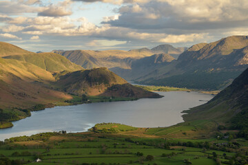 Aerial view of Crummock Water lake on a Summer evening with dramatic clouds. Western Fells, Lake...
