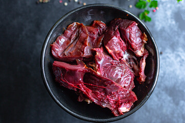 raw pork or beef heart piece of meat second course snack ready to eat on the table healthy meal snack ingredient top view copy space for text food background rustic keto or paleo diet