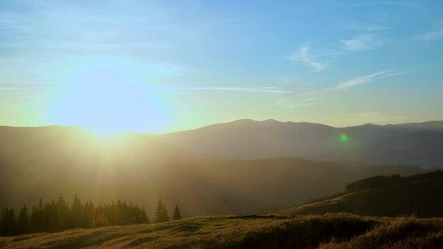 A man travels in the mountains. Beautiful nature of the Carpathian mountains. The concept of travel and active lifestyle. 4K