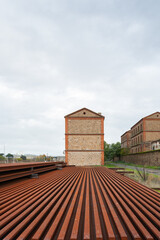 Rusted iron train rails and beams at the Monfrague Palazuelo Empalme train station in Malpartida de Plasencia.