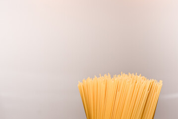 raw spaghetti pasta with copy space for text on Italian cuisine theme