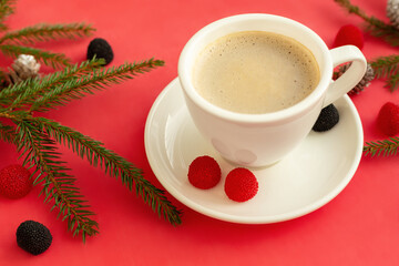 White cup with coffee on a red background.
Close-up, top view