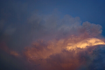 Naklejka na ściany i meble Storm clouds in the evening light 