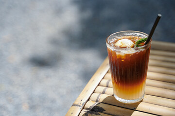 selective focus Long black coffee mixed with Lychee on nature background. iced drink menu of summer drink for relaxing day.